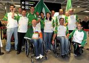 24 August 2010; Mark Rohan, from Athlone, Co. Westmeath, with the Paralympic Cycling team, on his return home after securing Ireland's first ever Paracycling World Championship Gold Medal by winning the H1 Handcycling Road Race in Baie-Comeau Canada. Dublin Airport, Dublin. Picture credit: Brian Lawless / SPORTSFILE