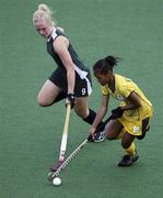 24 August 2010; Lisa McCarthy, Ireland, in action against Elan-Margo Van Vught, South Africa, during their classification 5th/6th girls' hockey match. Ireland won the match 3-1. 2010 Youth Olympic Games, Sengkang Hockey Stadium, Singapore.