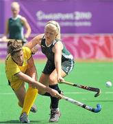 24 August 2010; Chloe Brown, Ireland, in action against Ann Gibbings, South Africa, during their classification 5th/6th girls' hockey match. Ireland won the match 3-1. 2010 Youth Olympic Games, Sengkang Hockey Stadium, Singapore.