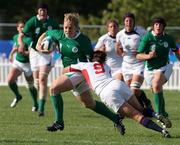 24 August 2010; Niamh Briggs, Ireland, in action against Claudia Knudsen-Braymer, USA. 2010 Women's Rugby World Cup - Pool B, Ireland v USA, Surrey Sports Park, Guildford, England. Picture credit: Matt Impey / SPORTSFILE