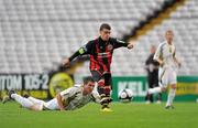 24 August 2010; Gary Burke, Bohemians A, gets past Jamie Duffy, Sporting Fingal A, to shoot and score his side's first goal. Newstalk Cup Final, Bohemians A v Sporting Fingal A, Dalymount Park, Dublin. Picture credit: Barry Cregg / SPORTSFILE