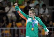 25 August 2010; Ireland's Ryan Burnett, Holy Family Boxing Club, Belfast, celebrates with his gold medal after the presentation in the Light Fly weight, 48kg, category. Burnett defeated Salman Alizida, of Azerbaijan, 13-6. 2010 Youth Olympic Games, International Convention Centre, Singapore. Picture credit: James Veale / SPORTSFILE