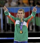 25 August 2010; Ireland's Ryan Burnett, Holy Family Boxing Club, Belfast, celebrates with his gold medal after the presentation in the Light Fly weight, 48kg, category. Burnett defeated Salman Alizida, of Azerbaijan, 13-6. 2010 Youth Olympic Games, International Convention Centre, Singapore.