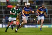 10 July 2016; Ger Browne of Tipperary in action against John Flynn of Limerick during the Electric Ireland Munster GAA Minor Hurling Championship Final match between Limerick and Tipperary at the Gaelic Grounds in Limerick Photo by Ray McManus/Sportsfile