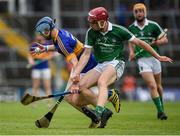 10 July 2016; Jake Morris of Tipperary in action against Finn Hourigan of Limerick during the Electric Ireland Munster GAA Minor Hurling Championship Final match between Limerick and Tipperary at the Gaelic Grounds in Limerick Photo by Ray McManus/Sportsfile