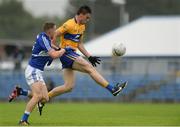 10 July 2016; Jamie Malone of Clare in action against Stephen Attride of Laois during the GAA Football All-Ireland Senior Championship - Round 2A match between Clare and Laois at Cusack Park in Ennis, Clare. Photo by Piaras Ó Mídheach/Sportsfile