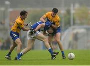 10 July 2016; Donal Kingston of Laois in action against David Tubridy, left, and Jamie Malone of Clare during the GAA Football All-Ireland Senior Championship - Round 2A match between Clare and Laois at Cusack Park in Ennis, Clare. Photo by Piaras Ó Mídheach/Sportsfile
