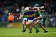 10 July 2016; Lydon Fairbrother of Tipperary in action against Killian O'Dwyer of Limerick during the Electric Ireland Munster GAA Minor Hurling Championship Final match between Limerick and Tipperary at the Gaelic Grounds in Limerick Photo by Ray McManus/Sportsfile