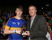 10 July 2016; Jake Morris of Tipperary receives the Man of the Match award from Paul Stapleton, General Manager, representing Electric Ireland following the Electric Ireland Munster GAA Minor Hurling Championship Final match between Limerick and Tipperary at the Gaelic Grounds in Limerick Photo by Ray McManus/Sportsfile