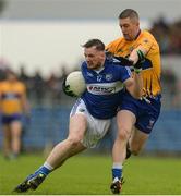 10 July 2016; Gary Walsh of Laois in action against Enda Coughlan of Clare during the GAA Football All-Ireland Senior Championship - Round 2A match between Clare and Laois at Cusack Park in Ennis, Clare. Photo by Piaras Ó Mídheach/Sportsfile