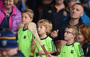 10 July 2016; Young tipperary supporters watch on as Tipperary captain Brendan Maher lifts the cup following his side's victory in the Munster GAA Hurling Senior Championship Final match between Tipperary and Waterford at the Gaelic Grounds in Limerick. Photo by Eóin Noonan/Sportsfile