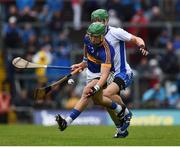 10 July 2016; James Barry of Tipperary in action against Tom Devine of Waterford during the Munster GAA Hurling Senior Championship Final match between Tipperary and Waterford at the Gaelic Grounds in Limerick.  Photo by Ray McManus/Sportsfile