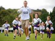 27 August 2010; Over 80,000 children have been taking part in over 1,000 Vhi GAA Cúl Camps in 4 different countries including Ireland, UK, Canada and USA this summer. Down captain Ambrose Rodgers is one of 22 ambassadors that have been visiting the Vhi GAA Cúl Camps throughout the summer, giving tips to children on how to improve their game and training the lucky children selected to take part in the Vhi Cúl Day Out in September and today Ambrose officially closed the Vhi GAA Cúl Camps at Kilmacud Crokes GAA Club. Kilmacud Crokes GAA Club, Glenalbyn, Stillorgan, Co. Dublin. Picture credit: Stephen McCarthy / SPORTSFILE