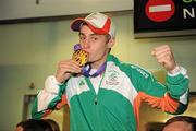 27 August 2010; Youth Olympics Gold Medallist Ryan Burnett, Holy Family Boxing Club, Belfast, arrives back to Ireland after winner gold in the Light Fly weight, 48kg, category. Dublin Airport, Dublin. Photo by Sportsfile