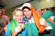 27 August 2010; Youth Olympics Gold Medallist Ryan Burnett, Holy Family Boxing Club, Belfast, with his brother Eoghan, aged 12, on his arrival back to Ireland after winner gold in the Light Fly weight, 48kg, category. Dublin Airport, Dublin. Photo by Sportsfile