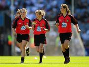 29 August 2010; Caoimhe Lyons, Monaleen N.S., Co. Limerick, left, Danika O'Grady, Glenbeigh N.S., Glenbeigh, Co. Kerry, and Chloe Hawker, Scoil Réalta na Mara, Tousist, Co. Kerry, right, representing Down, run onto the pitch ahead of the game. GAA I.N.T.O. Mini-Sevens during half time of the GAA Football All-Ireland Senior Championship Semi-Final, Kildare v Down, Croke Park, Dublin. Picture credit: Stephen McCarthy / SPORTSFILE