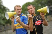 25 August 2010; Hurling rivals from Kilkenny and Tipperary go head to head to launch the Aviva ‘Have You Got Balls Challenge’. Along with Aviva, All Ireland Hurlers, Lar Corbett from Tipperary and Kilkenny’s Eddie Brennan, are challenging men to put their sports balls to the test against the sports stars while raising money for the Irish Heart Foundation. Tipperary hurler Lar Corbett, left, and Kilkenny hurler Eddie Brennan are pictured at the launch of Aviva Health Insurance Benefit with Fit Squad. Durrow, Co. Laois. Picture credit: Brian Lawless / SPORTSFILE