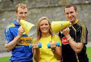 25 August 2010; Hurling rivals from Kilkenny and Tipperary go head to head to launch the Aviva ‘Have You Got Balls Challenge’. Along with Aviva, All Ireland Hurlers, Lar Corbett from Tipperary and Kilkenny’s Eddie Brennan, are challenging men to put their sports balls to the test against the sports stars while raising money for the Irish Heart Foundation. Tipperary hurler Lar Corbett, left, and Kilkenny hurler Eddie Brennan are pictured with Fitsquad trainer Kate Ryan during the launch of Aviva Health Insurance Benefit with Fit Squad. Durrow, Co. Laois. Picture credit: Brian Lawless / SPORTSFILE