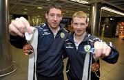 29 August 2010; Joe Markey, left, from Monaghan, and Brian McGillivary, from Dublin, with their bronze medals on their arrival back to Ireland following the Cerebral Palsy International Sports and Recreation Association Football 7-a-side European Championships 2010. Dublin Airport, Dublin. Photo by Sportsfile