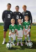 31 August 2010; Pictured are children, from left to right, Nathan Howard, age 4, from Ashbourne, Co. Meath, Ella Williams, age 4, from Balbriggan, Co. Dublin and Alex Howard, age 7, from Ashbourne, Co. Meath, with Republic of Ireland Internationals, left to right, Shane Long, Robbie Keane and Paul McShane, at the announcement today by 3, Ireland’s largest high speed network, and the Football Association of Ireland of an exciting opportunity for one lucky young football fan to be the next mascot when the senior National team play Andorra in the Aviva Stadium on September 7th 2010. The winner will have the chance of a lifetime to lead the team onto the pitch with the captain, Robbie Keane. All entrants must be 7-11 years old. To nominate a mascot, visit www.three.ie and submit 50 words on why your nominated child would make a great mascot for the Irish National football team. The winner will be announced after the team training session on Monday 6th September and the prize will also include overnight accommodation and a new 3Pay phone from 3 for the nominator. Gannon Park, Malahide, Co. Dublin. Picture credit: David Maher / SPORTSFILE
