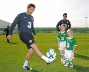 31 August 2010; Republic of Ireland captain Robbie Keane shows off his skills to Nathan Howard, age 4, and his sister Alex, age 7, from Ashbourne, Co. Meath, at the announcement today by 3, Ireland’s largest high speed network, and the Football Association of Ireland of an exciting opportunity for one lucky young football fan to be the next mascot when the senior National team play Andorra in the Aviva Stadium on September 7th 2010. The winner will have the chance of a lifetime to lead the team onto the pitch with the captain, Robbie Keane. All entrants must be 7-11 years old. To nominate a mascot, visit www.three.ie and submit 50 words on why your nominated child would make a great mascot for the Irish National football team. The winner will be announced after the team training session on Monday 6th September and the prize will also include overnight accommodation and a new 3Pay phone from 3 for the nominator. Gannon Park, Malahide, Co. Dublin. Picture credit: David Maher / SPORTSFILE
