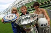 31 August 2010; Hector O'hEochagain, holding the Magners League Cup, who will be presenting 'Ceist GAA', with rugby presenter Maire Treasa Ni Dhubhghaill, left, and GAA presenter Gráinne McElwain, at the Launch of TG4 Autumn Schedule 2010. The Aviva Stadium, Lansdowne Road, Dublin. Photo by Sportsfile