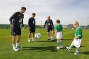 31 August 2010; Nathan Howard, age 4, and his sister Alex, age 7, from Ashbourne, Co. Meath, show off their skills to Republic of Ireland players  Robbie Keane, Shane Long and Paul McShane at the announcement today by 3, Ireland’s largest high speed network, and the Football Association of Ireland of an exciting opportunity for one lucky young football fan to be the next mascot when the senior National team play Andorra in the Aviva Stadium on September 7th 2010. The winner will have the chance of a lifetime to lead the team onto the pitch with the captain, Robbie Keane. All entrants must be 7-11 years old. To nominate a mascot, visit www.three.ie and submit 50 words on why your nominated child would make a great mascot for the Irish National football team. The winner will be announced after the team training session on Monday 6th September and the prize will also include overnight accommodation and a new 3Pay phone from 3 for the nominator. Gannon Park, Malahide, Co. Dublin. Picture credit: David Maher / SPORTSFILE