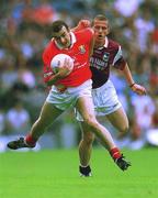 22 July 2001; John Miskella of Cork in action against Sean Og De Paor of Galway during the Bank of Ireland All-Ireland Senior Football Championship Qualifier, round 4, match between Galway and Cork at Croke Park in Dublin. Photo by Brendan Moran/Sportsfile