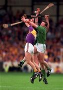 1 September 1996;  Larry O'Gorman of Wexford in action against Mark Foley of Limerick during the Guinness All-Ireland Senior Hurling Championship Final match between Wexford and Limerick at Croke Park in Dublin. Photo by Ray McManus/Sportsfile