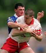 22 July 2001; Enda Muldoon of Derry in action against James Doonan of Cavan during the Bank of Ireland All-Ireland Senior Football Championship Qualifier, round 4, match between Derry and Cavan at St. Tiernach's Park in Clones, Monaghan. Photo by Damien Eagers/Sportsfile