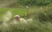 27 July 2001; Arnold Palmer plays out of the bunker onto the 4th green during Day 2 of the Senior British Open Golf Champonship at The Royal County Down Golf Club in Newcastle, Down. Photo by Matt Browne/Sportsfile