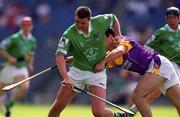 29 July 2001; Brian Begley of Limerick attempts to get away from Darragh Ryanof Wexford during the Guinness All-Ireland Senior Hurling Championship Quarter-Final match between Wexford and Limerick at Croke Park in Dublin. Photo by Damien Eagers/Sportsfile