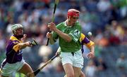 29 July 2001; Ollie Moran of Limerick in action against David O'Connor, left, and Liam Dunne of Wexford during the Guinness All-Ireland Senior Hurling Championship Quarter-Final match between Wexford and Limerick at Croke Park in Dublin. Photo by Damien Eagers/Sportsfile