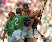 29 July 2001; Nicky Lambert of Wexford tussles with Stephen McDonagh of Limerick during the Guinness All-Ireland Senior Hurling Championship Quarter-Final match between Wexford and Limerick at Croke Park in Dublin. Photo by Damien Eagers/Sportsfile