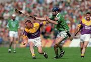 29 July 2001; Larry Murphy of Wexford in action against Brian Geary of Limerick during the Guinness All-Ireland Senior Hurling Championship Quarter-Final match between Wexford and Limerick at Croke Park in Dublin. Photo by Damien Eagers/Sportsfile