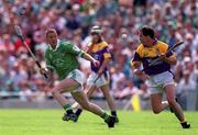 29 July 2001; Adrian Fenlon of Wexford in action against Ciaran Carey of Limerick during the Guinness All-Ireland Senior Hurling Championship Quarter-Final match between Wexford and Limerick at Croke Park in Dublin. Photo by Damien Eagers/Sportsfile