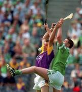 29 July 2001; Darragh Ryan of Wexford contests a dropping ball with Brian Begley of Limerick during the Guinness All-Ireland Senior Hurling Championship Quarter-Final match between Wexford and Limerick at Croke Park in Dublin. Photo by Damien Eagers/Sportsfile