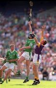 29 July 2001; Brian Geary of Limerick in action against Larry Murphy of Wexford during the Guinness All-Ireland Senior Hurling Championship Quarter-Final match between Wexford and Limerick at Croke Park in Dublin. Photo by Damien Eagers/Sportsfile