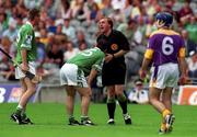 29 July 2001; Limerick captain Barry Foley and Owen O'Neill, left, who was fouled, remonstrate with referee Michael Wadding during the Guinness All-Ireland Senior Hurling Championship Quarter-Final match between Wexford and Limerick at Croke Park in Dublin. Photo by Damien Eagers/Sportsfile