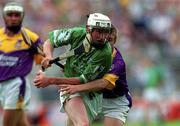 29 July 2001; Paul O'Grady of LImerick is tackled by Trevor Kelly of Wexford during the Guinness All-Ireland Senior Hurling Championship Quarter-Final match between Wexford and Limerick at Croke Park in Dublin. Photo by Damien Eagers/Sportsfile