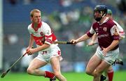 29 July 2001; Gregory Biggs of Derry in action against Liam Hodgins of Galway during the Guinness All-Ireland Senior hurling Championship Quarter-Final match between Galway and Derry at Croke Park in Dublin. Photo by Damien Eagers/Sportsfile