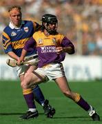 17 August 1997; Sean Flood of Wexford in action against Declan Ryan of Tipperary during the Guinness All-Ireland Senior Hurling Championship Semi-Final match between Tipperary and Wexford at Croke Park in Dublin. Photo by David Maher/Sportsfile