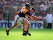 17 August 1997;  Larry Murphy of Wexford in action against Liam Sheedy of Tipperary during the Guinness All-Ireland Senior Hurling Championship Semi-Final match between Tipperary and Wexford at Croke Park in Dublin. Photo by David Maher/Sportsfile