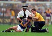 17 August 1997; Thomas Dunne of Tipperary is attended to after receiving an injury during the Guinness All-Ireland Senior Hurling Championship Semi-Final match between Tipperary and Wexford at Croke Park in Dublin. Photo by David Maher/Sportsfile