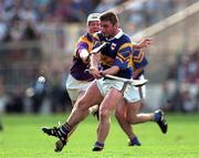 17 August 1997; Paul Shelly of Tipperary in action against Tom Dempsey of Wexford during the Guinness All-Ireland Senior Hurling Championship Semi-Final match between Tipperary and Wexford at Croke Park in Dublin. Photo by David Maher/Sportsfile
