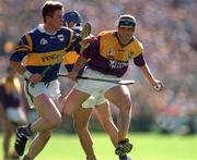 17 August 1997; Larry O'Gorman of Wexford in action against Conor Gleeson of Tipperary during the Guinness All-Ireland Senior Hurling Championship Semi-Final match between Tipperary and Wexford at Croke Park in Dublin. Photo by David Maher/Sportsfile
