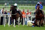 2 August 2001; Darapour with Charlie Swan up runs clear after clearing the last ahead of Rough Gamble, David Casey up, as Goldenhalo with Ruby Walsh takes a fall, to win the Compaq Alphaserver SC Hurdle during day 4 of the Galway Summer Racing Festival at Ballybrit Racecourse in Galway. Photo by Damien Eagers/Sportsfile