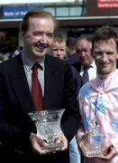 2 August 2001; Winning jockey Paul Carberry and winning trainer Dermot Weld pictured after Ansar won the Guinness Galway Hurdle Handicap during day 4 of the Galway Summer Racing Festival at Ballybrit Racecourse in Galway. Photo by Damien Eagers/Sportsfile