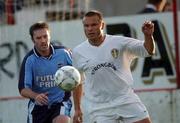 3 August 2001; Mark Viduka of Leeds United in action against Ray McLoughlin of Dublin City during a pre-season friendly match between Dublin City and Leeds United at Tolka Park in Dublin Photo by David Maher/Sportsfile