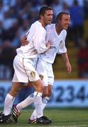 3 August 2001; Robbie Keane of Leeds United celebrates with team-mate Lee Bowyer after scoring his third third goal during a pre-season friendly match between Dublin City and Leeds United at Tolka Park in Dublin Photo by David Maher/Sportsfile